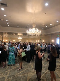 a group of people standing in a room