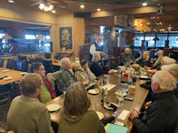 a group of people sitting at a table