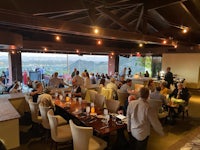 a restaurant with a view of the mountains