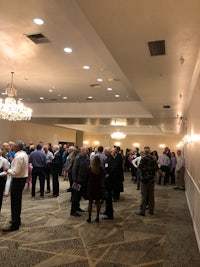 a group of people standing in a room