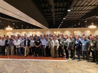 a group of people standing together in a room