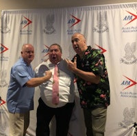 three men posing for a photo